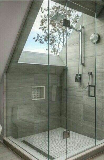 Love how the shower has a skylight in it and uses the angle of the .