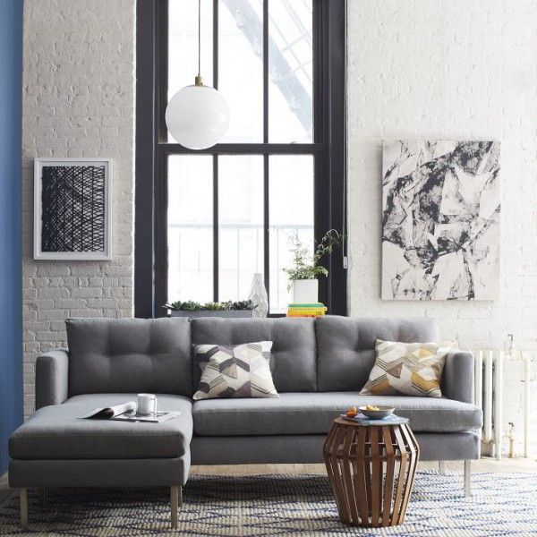Loft, white brick wall, grey sofa, black framed window | Ecksofas .