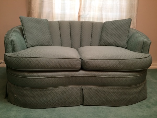 Used Kidney shaped, solid built loveseat with pillows for sale in .